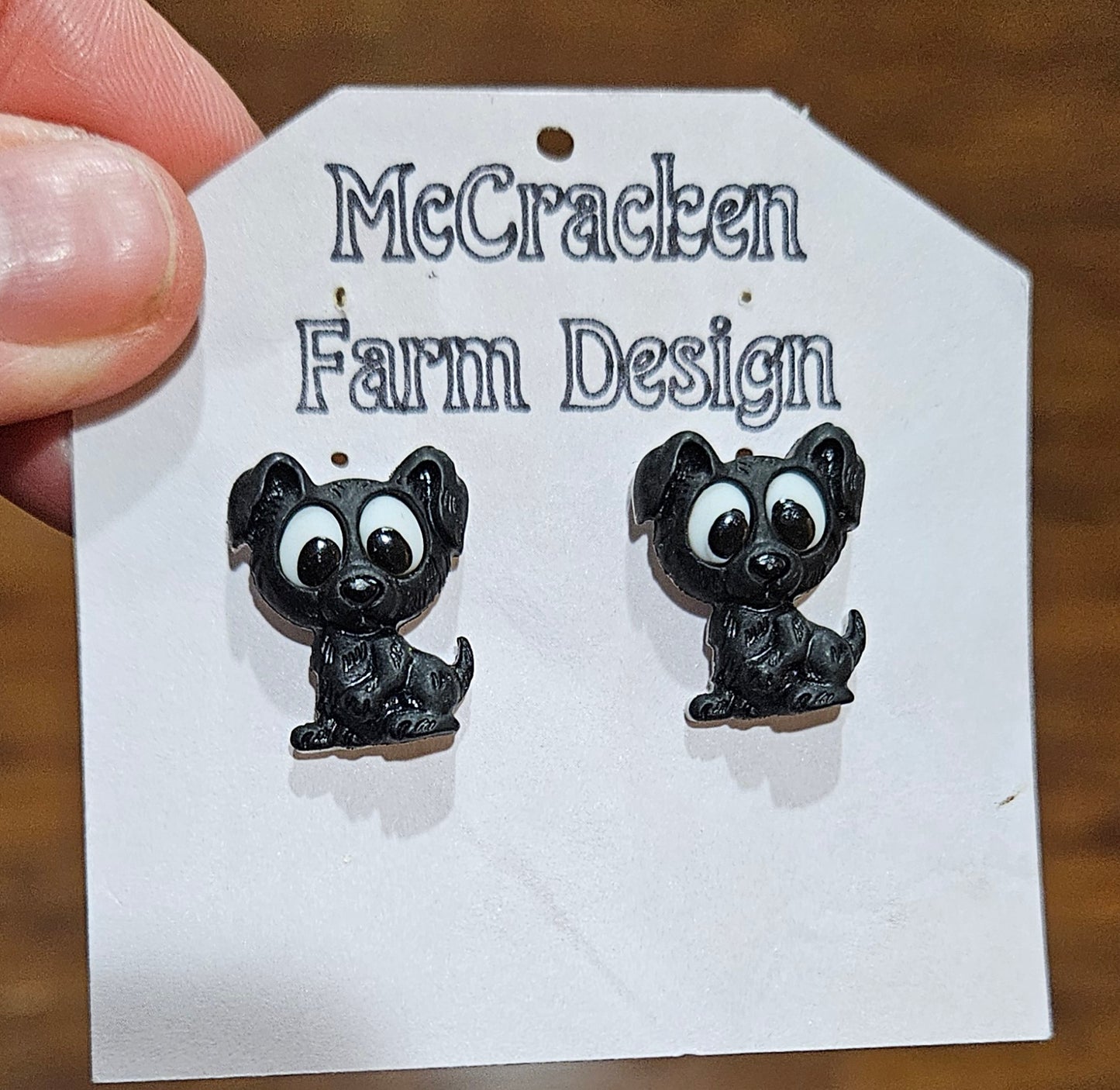 Black puppy button earrings
