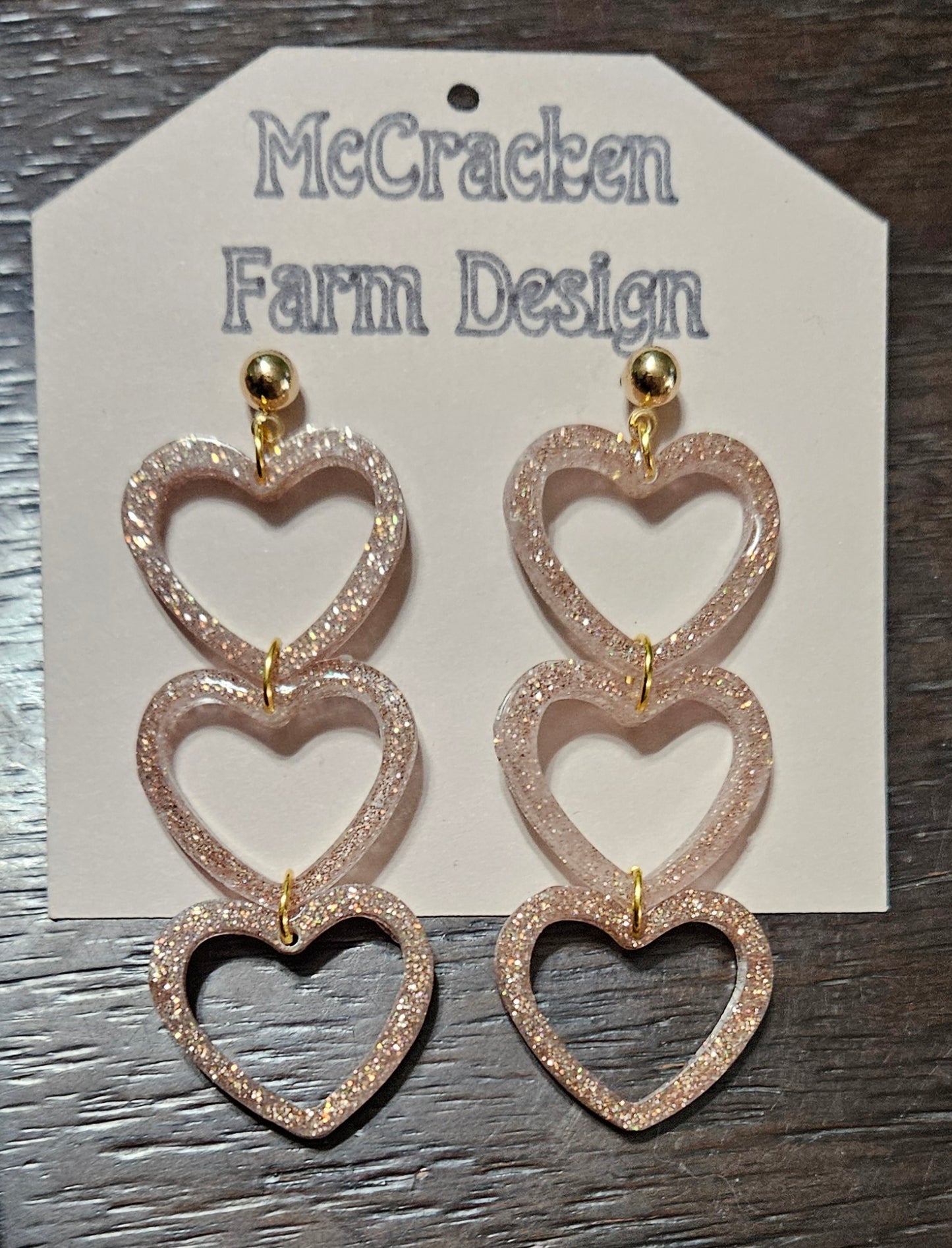 Triple golden glitter heart dangles