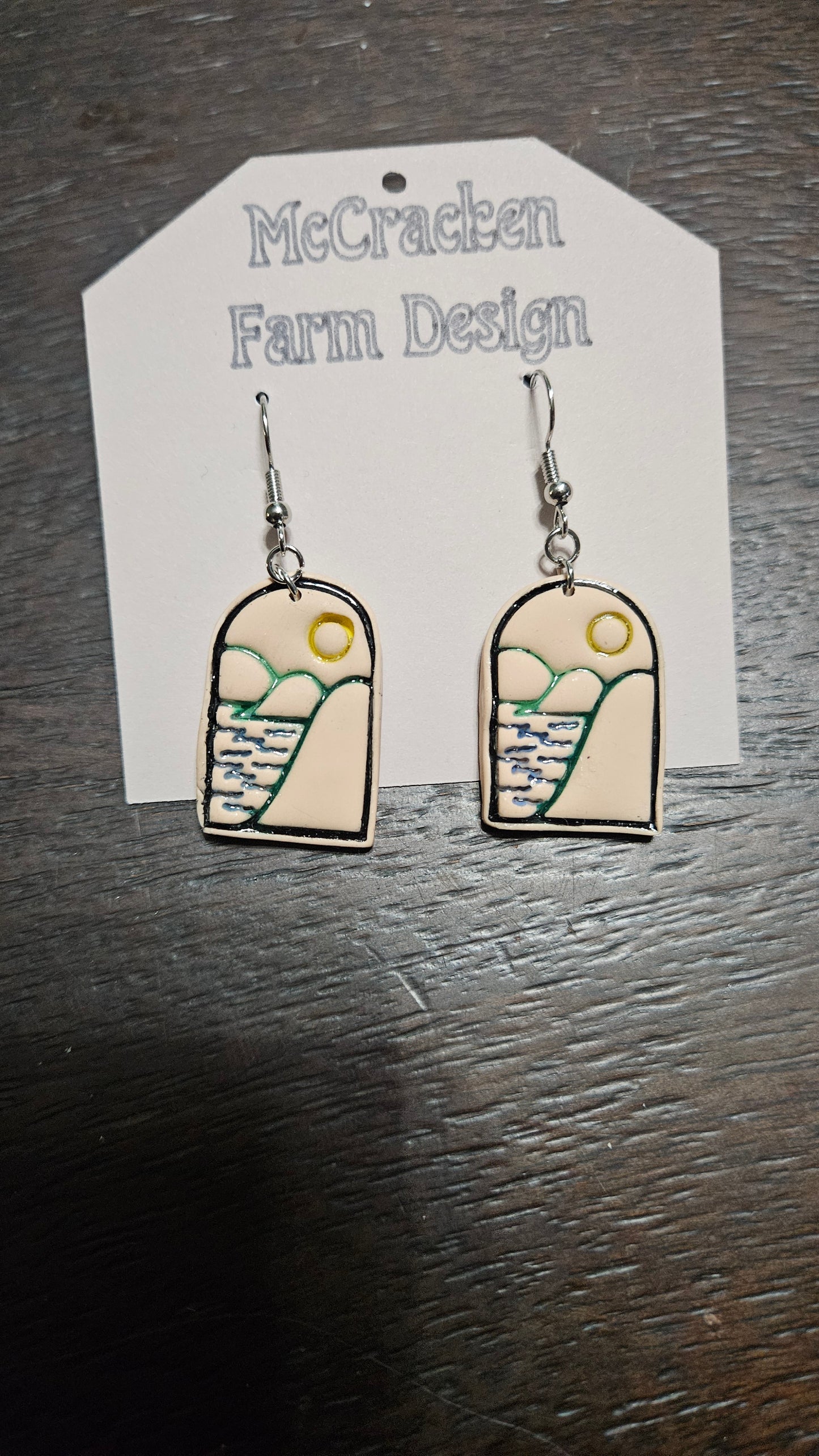 Colored embossed water and hills scene