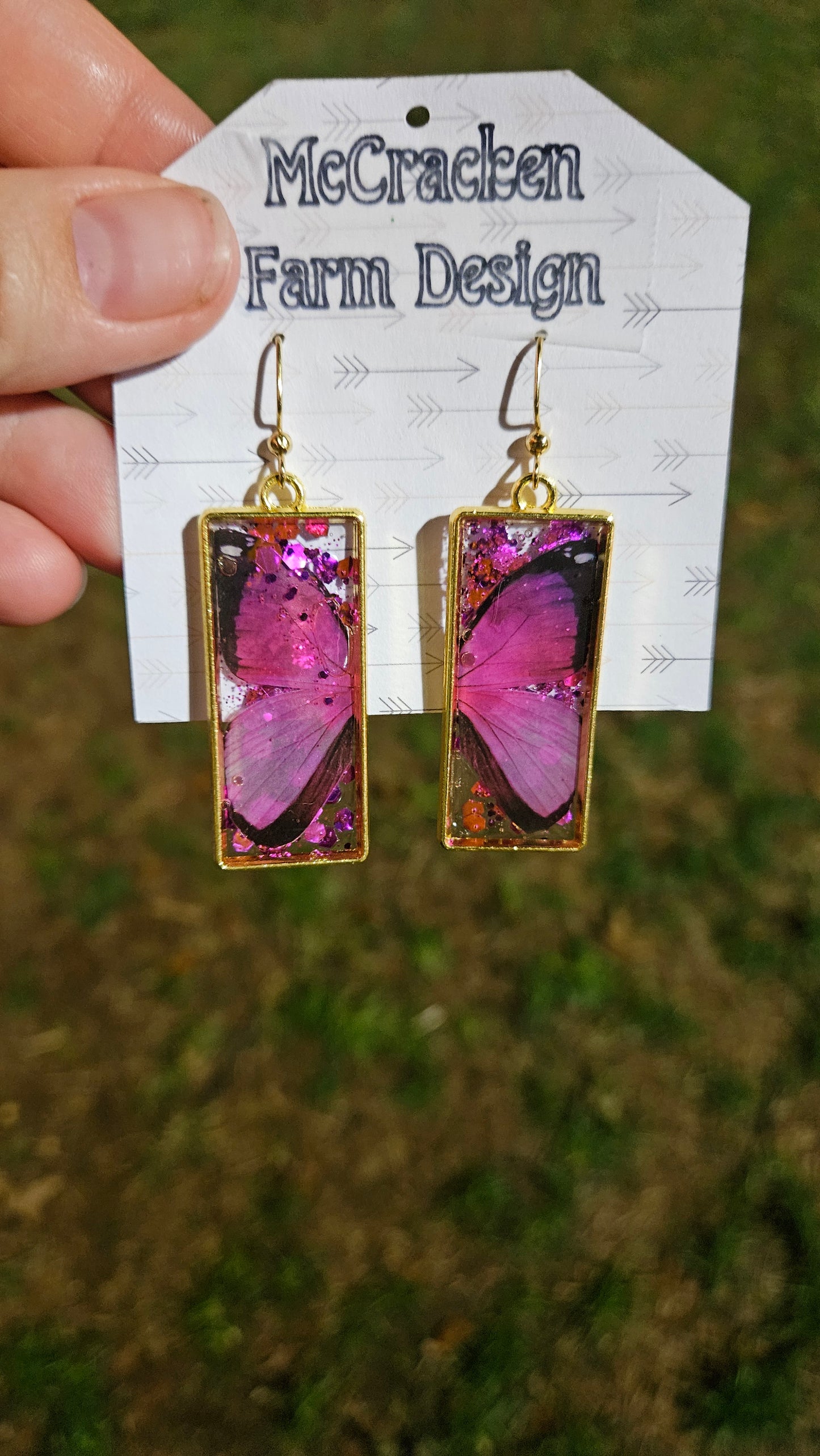 Gold framed pink and black butterfly