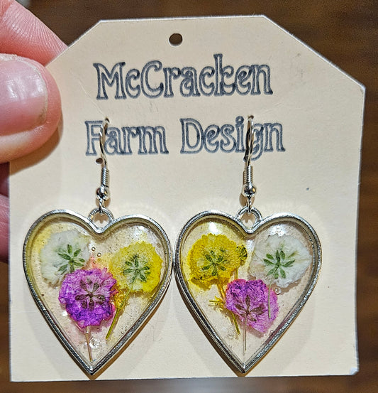 Heart framed flower trio in resin