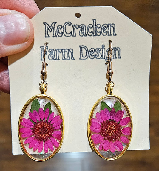 Oval metal framed pink flowers in resin