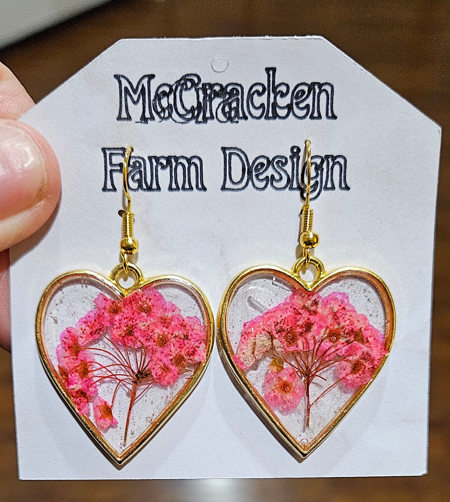 Golden heart framed pink flowers in resin