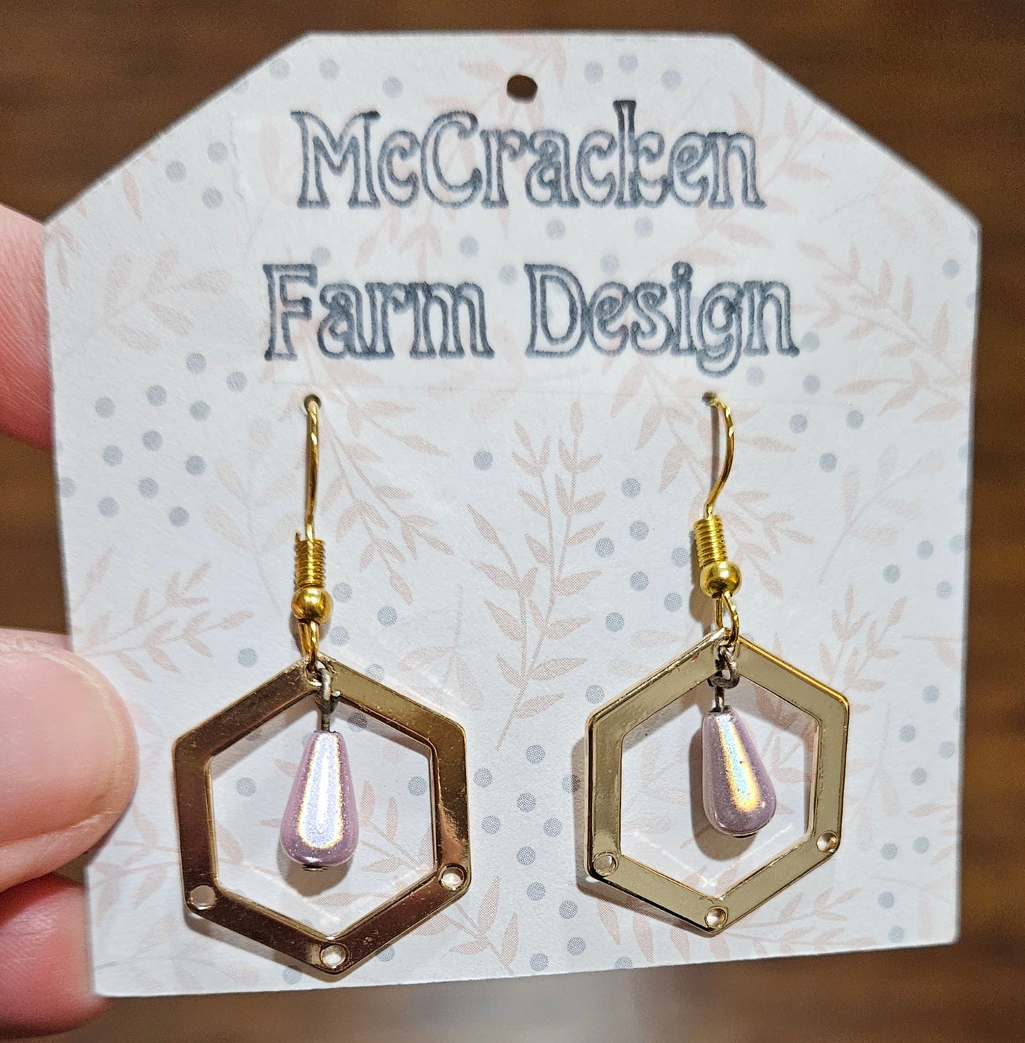 Pink teardrop golden hexagon