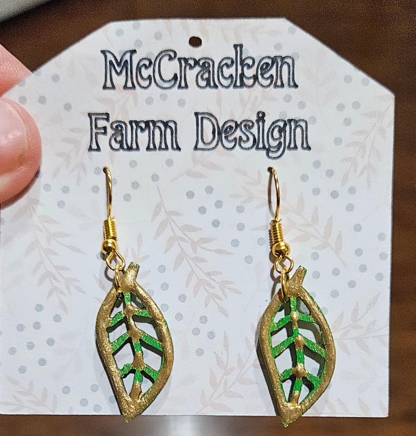 Golden painted wooden leaf earrings