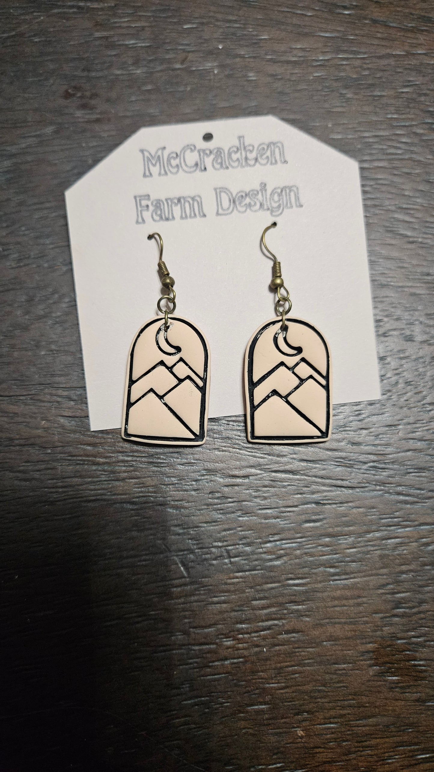 Black outlined embossed mountain scene