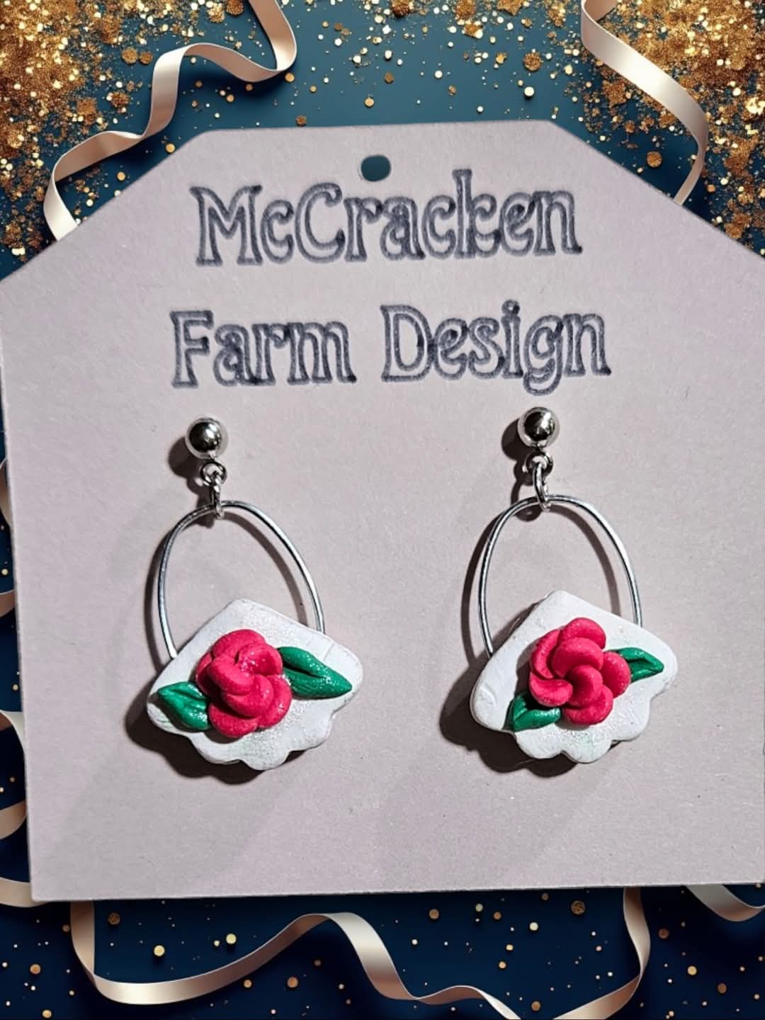 Rose metal dangle w/white background