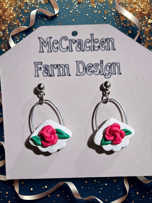 Rose metal dangle w/white background